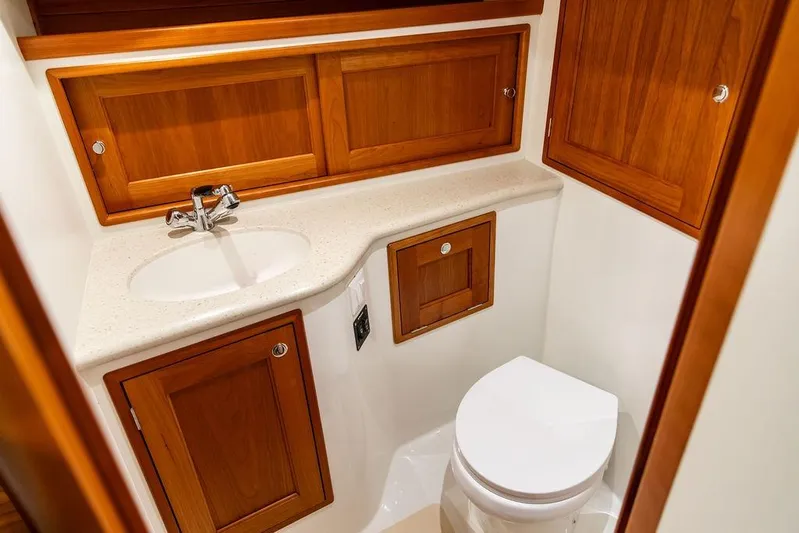 Mare Yacht Photos Pics 2018 MJM 35z yacht bathroom with wooden cabinets and modern fixtures.