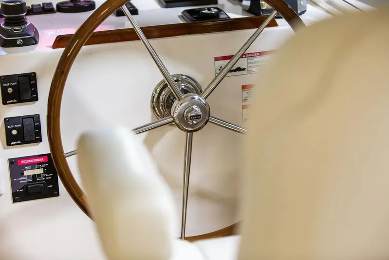 Mare Yacht Photos Pics Steering wheel of 2018 MJM 35z boat with control panels and gauges.