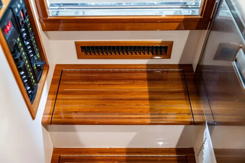 Mare Yacht Photos Pics 2018 MJM 35z interior with polished wooden steps and control panel.