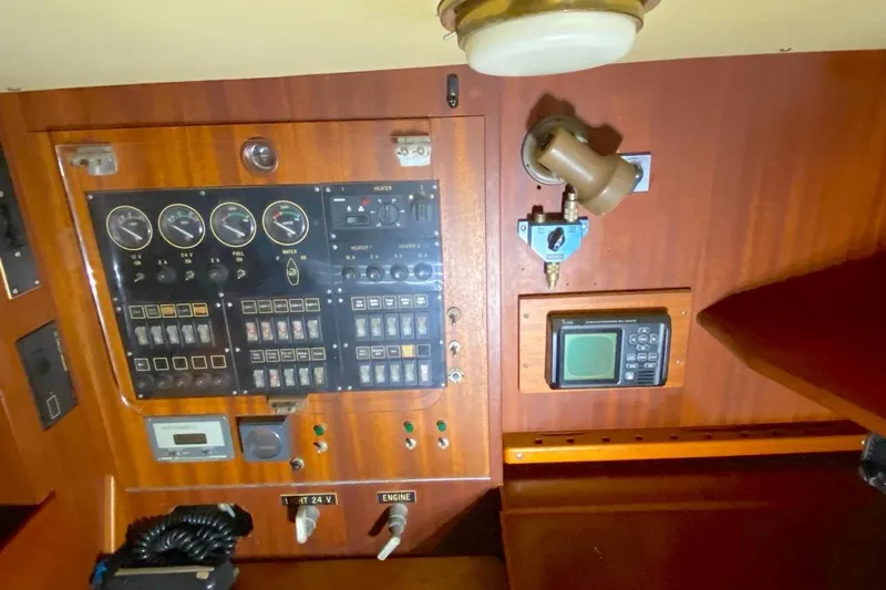Challanger Yacht Photos Pics Control panel of a 1992 Hallberg-Rassy 45 yacht with gauges and switches.