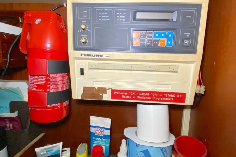 Challanger Yacht Photos Pics Control panel and fire extinguisher on a 1992 Hallberg-Rassy 45 yacht.