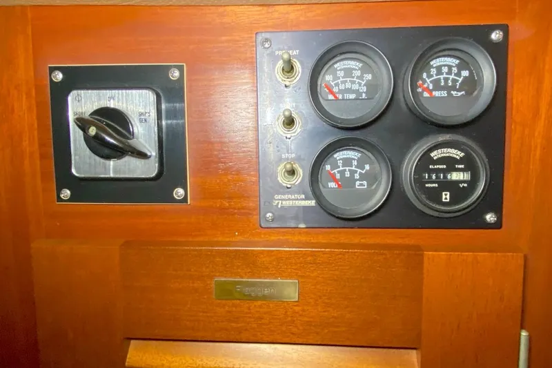 Challanger Yacht Photos Pics Control panel of a 1992 Hallberg-Rassy 45 yacht with gauges and switches.