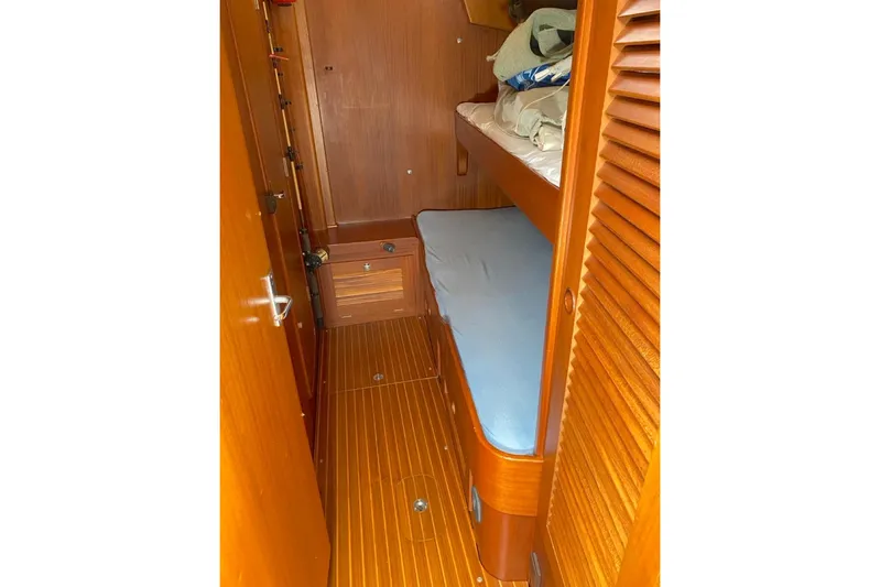 Challanger Yacht Photos Pics 1992 Hallberg-Rassy 45 yacht cabin with wooden interior and bunk beds.