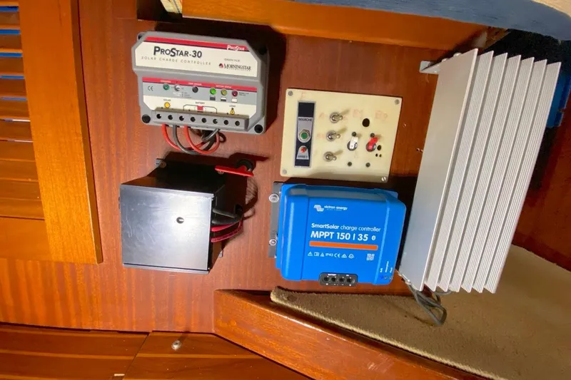 Challanger Yacht Photos Pics Electrical panel with solar charge controllers on a 1992 Hallberg-Rassy 45 yacht.