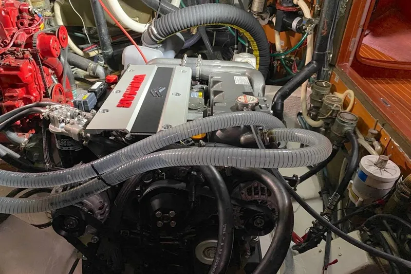 Challanger Yacht Photos Pics Engine room of a 1992 Hallberg-Rassy 45 yacht with visible Yanmar engine components.