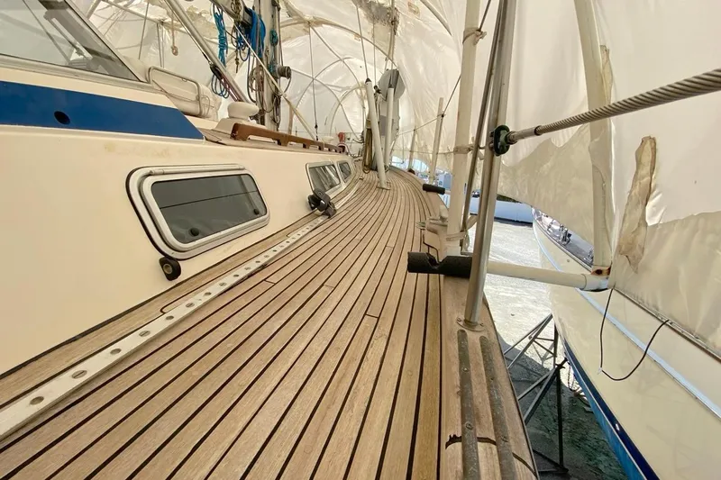 Challanger Yacht Photos Pics Deck view of 1992 Hallberg-Rassy 45 sailboat with teak wood finish.