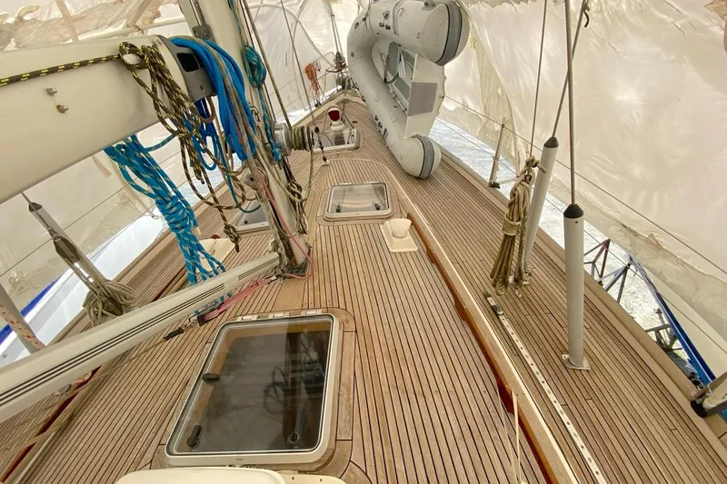 Challanger Yacht Photos Pics Deck of 1992 Hallberg-Rassy 45 sailboat with ropes and hatches under cover.