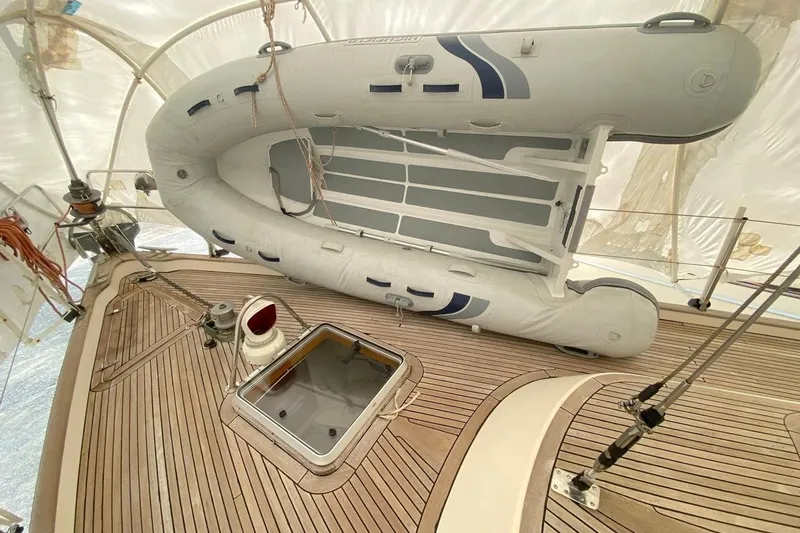 Challanger Yacht Photos Pics Deck of 1992 Hallberg-Rassy 45 with inflatable dinghy and hatch.