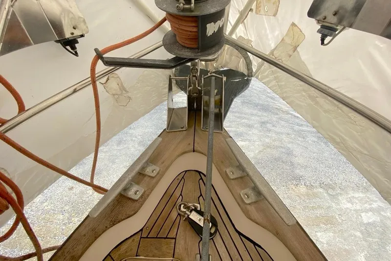 Challanger Yacht Photos Pics Bow view of 1992 Hallberg-Rassy 45 sailboat with anchor and ropes.