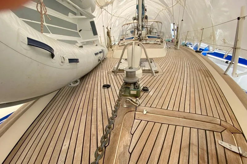 Challanger Yacht Photos Pics Deck of 1992 Hallberg-Rassy 45 yacht with wooden finish and inflatable boat.