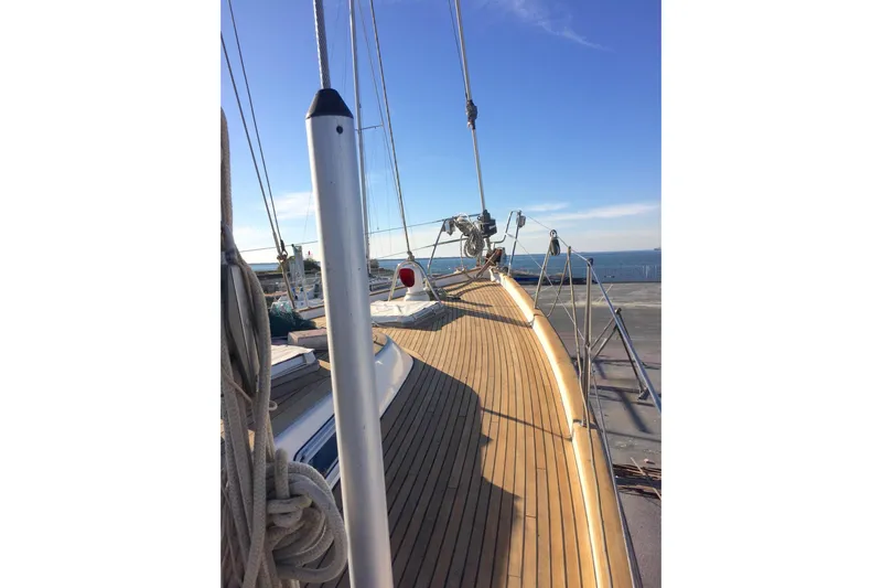 Challanger Yacht Photos Pics Deck view of 1992 Hallberg-Rassy 45 sailboat with clear blue sky.