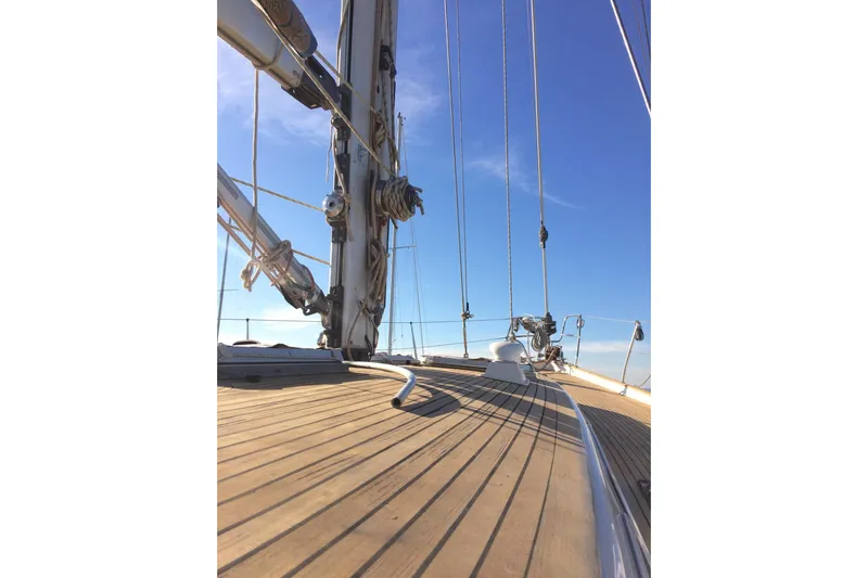 Challanger Yacht Photos Pics Deck view of 1992 Hallberg-Rassy 45 sailboat under clear blue sky.