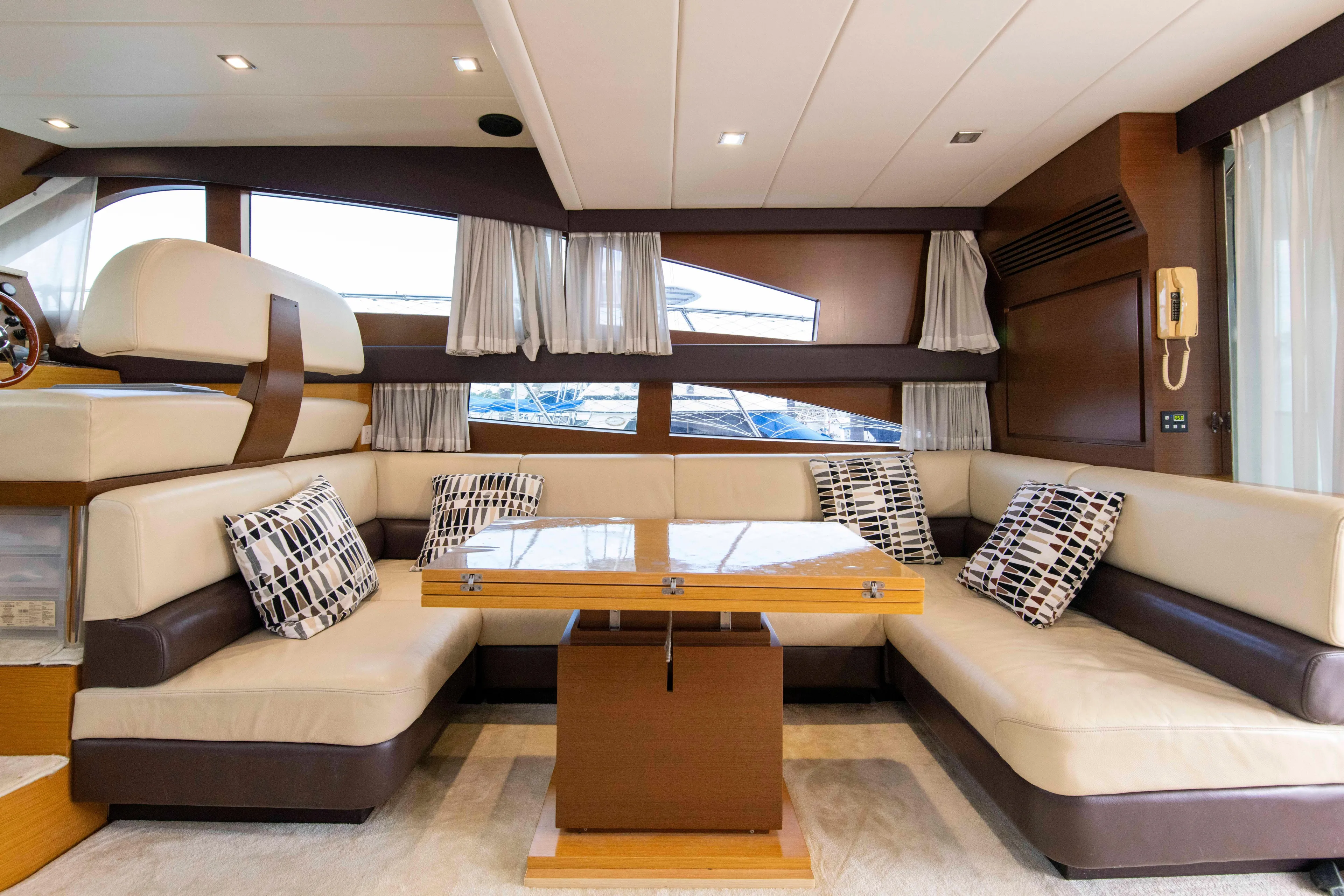 Luxurious interior of 2009 Ruby 52 yacht with elegant seating and modern decor.