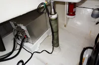 Engine room of 2021 Leopard 50 yacht with equipment and fire extinguisher.