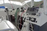 Cockpit of 2021 Leopard 50 yacht with steering wheel and navigation controls.