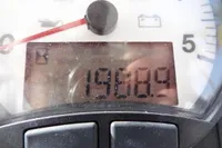Close-up of Leopard 50 speedometer displaying 19809 kilometers, 2021 model.
