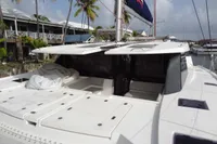 2021 Leopard 50 catamaran docked at marina, featuring spacious deck and modern design.