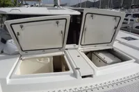 Open storage compartments on a 2021 Leopard 50 catamaran deck.