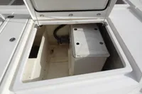 Open storage compartment on a 2021 Leopard 50 boat, showing interior details.