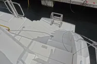 Steps leading to water on a 2021 Leopard 50 yacht, docked at a marina.