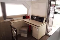 Interior of 2021 Leopard 50 yacht with modern navigation station and seating area.