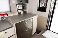 Modern kitchen area in a 2021 Leopard 50 yacht with stainless steel appliances.