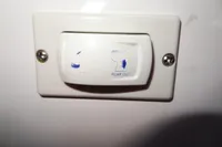 Wall-mounted switch labeled "Pump Out" on a Leopard 50, 2021 model.