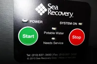 Control panel of Sea Recovery system with start and stop buttons.