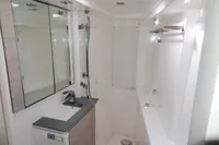 Modern bathroom interior in a 2021 Leopard 50 yacht, featuring sleek fixtures and mirrored cabinets.