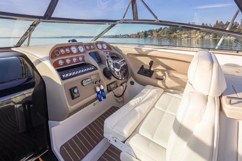 Sophia Grace Yacht Photos Pics 2006 Cobalt 323 boat interior with luxurious white seating and modern dashboard controls.