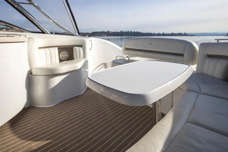 Sophia Grace Yacht Photos Pics Luxurious interior of 2006 Cobalt 323 boat with white seating and table.
