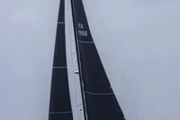 Sailing yacht Solaris 58, 2016 model, with black sails on open water.