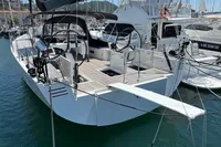 2016 Solaris 58 yacht docked in marina, featuring sleek design and spacious deck.
