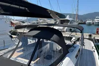 Luxury Solaris 58 yacht, 2016 model, docked at marina with sleek design and spacious deck.