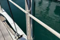 Close-up of a Solaris 58 yacht's polished metal stanchion and rope, docked in 2016.
