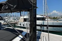Deck view of a 2016 Solaris 58 yacht, featuring mast and rigging in a marina.
