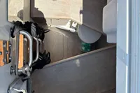 Interior of a 2016 Solaris 58 yacht, featuring a compact bathroom space.