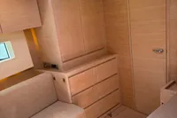 Luxurious interior of a 2016 Solaris 58 yacht with modern wood finish and skylight.