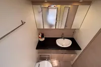 Modern bathroom interior of 2016 Solaris 58 yacht with sleek sink and mirror.