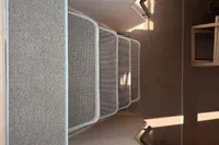 Carpeted stairs inside a 2016 Solaris 58 yacht, featuring metal handrails.