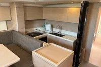 Modern kitchen interior of 2016 Solaris 58 yacht with sleek cabinetry and seating area.