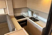 Modern kitchen interior in a 2016 Solaris 58 yacht, featuring sleek cabinetry and dual sinks.