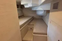 Interior cabin of 2016 Solaris 58 yacht with minimalist design and light wood finish.