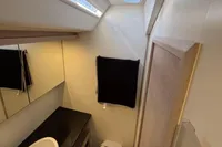 Compact bathroom in a 2016 Solaris 58 yacht with modern fixtures and natural lighting.