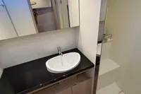 Modern bathroom interior of 2016 Solaris 58 yacht with sleek sink and shower area.