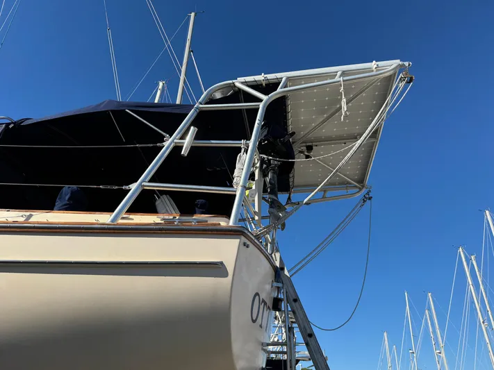 Otter II Yacht Photos Pics Island Packet 45 sailboat, 1999 model, with solar panels and blue sky background.