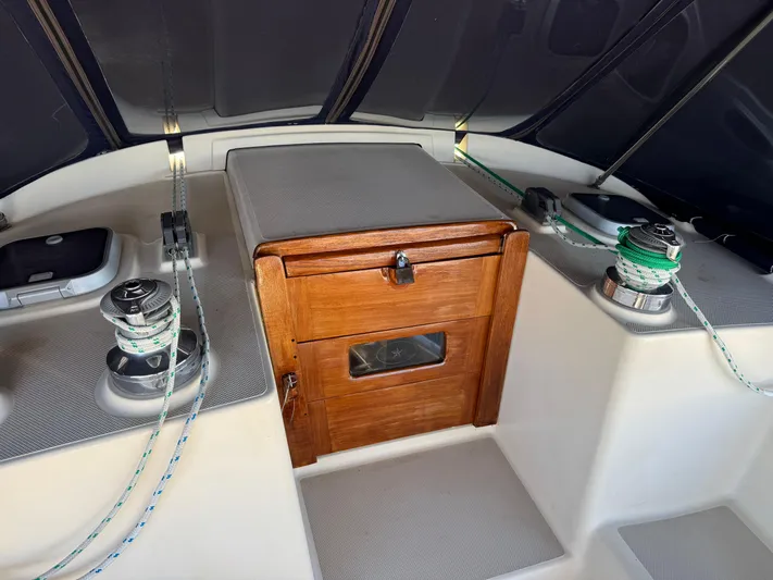 Otter II Yacht Photos Pics 1999 Island Packet 45 sailboat cockpit with winches and wooden hatch.