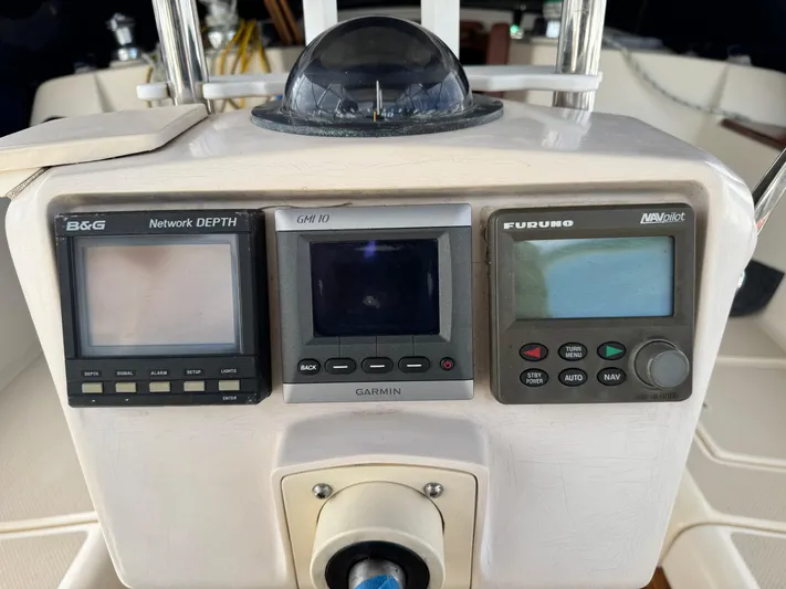 Otter II Yacht Photos Pics Control panel of a 1999 Island Packet 45 sailboat with navigation instruments.