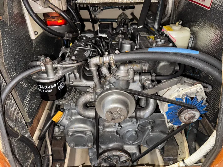 Otter II Yacht Photos Pics Engine compartment of a 1999 Island Packet 45 sailboat, showcasing mechanical components and fuel filter.