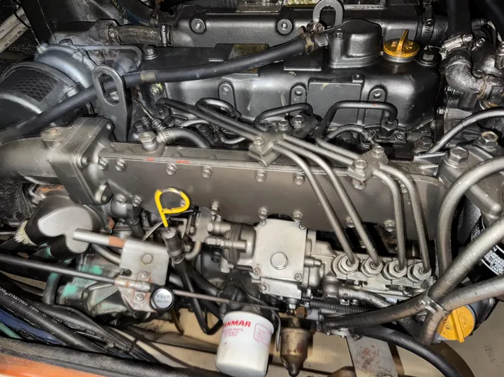 Otter II Yacht Photos Pics Engine of a 1999 Island Packet 45 sailboat, showcasing intricate mechanical components.